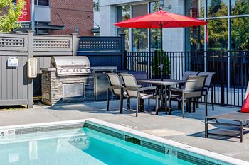 Poolside patio and lounge with outdoor grilling station